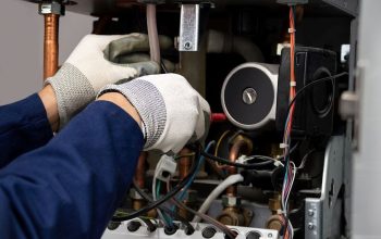 Norwich homeowner checking a boiler, illustrating cost-saving boiler repair and maintenance hacks