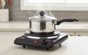 OVENTE 1000W single burner hot plate heating a pot on a kitchen counter
