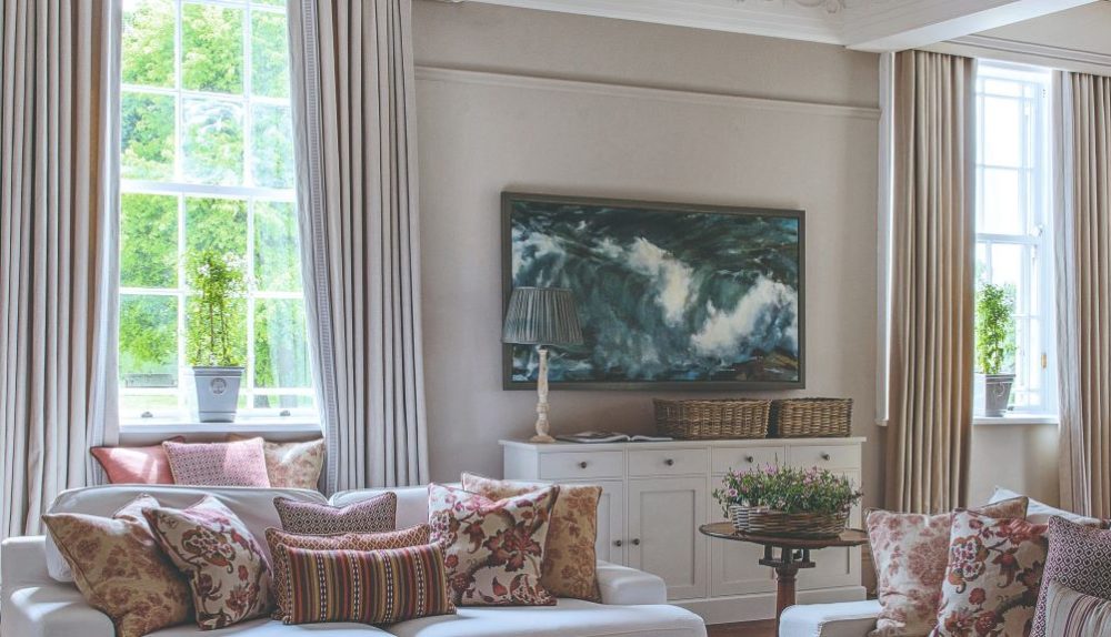 Elegant budget curtains creating a luxurious look in a modern living room.