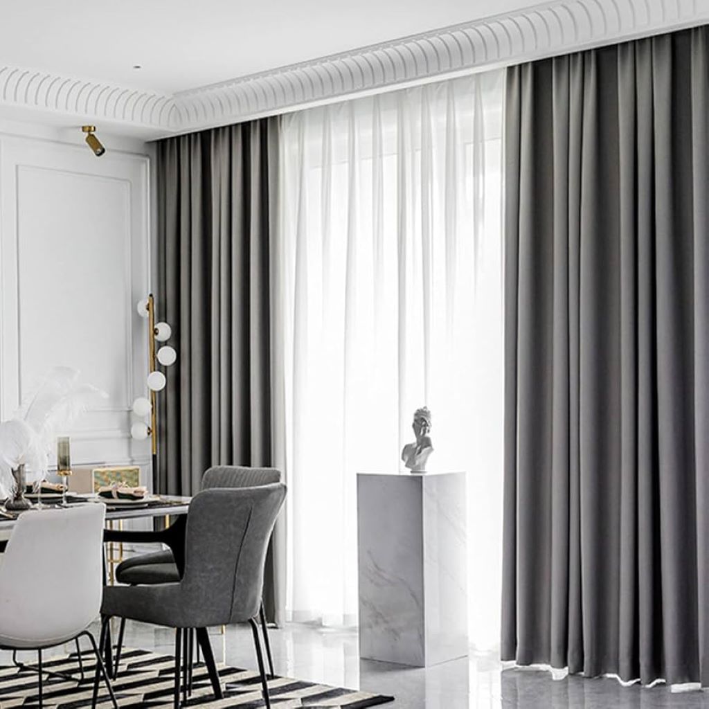 Stylish blackout curtains in a cozy living room with natural light control